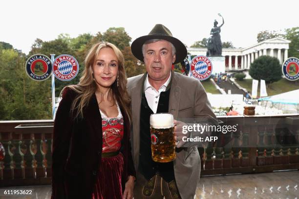 Bayern Munich's Italian head coach Carlo Ancelotti and his wife Mariann Barrena McClay pose during the traditional visit of FC Bayern Munich at the...