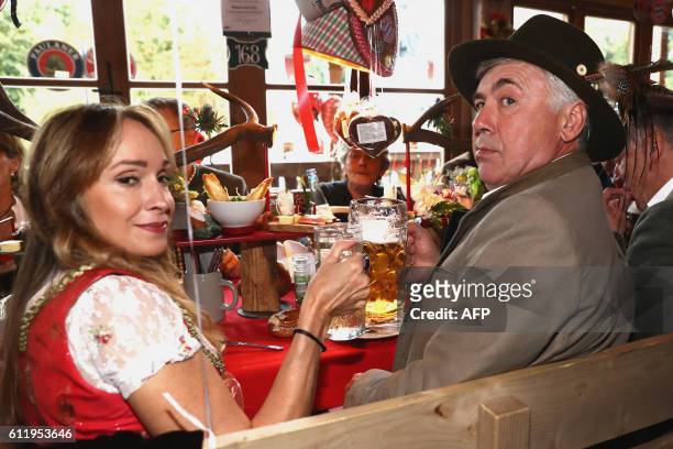 Bayern Munich's Italian head coach Carlo Ancelotti and his wife Mariann Barrena McClay pose during the traditional visit of FC Bayern Munich at the...