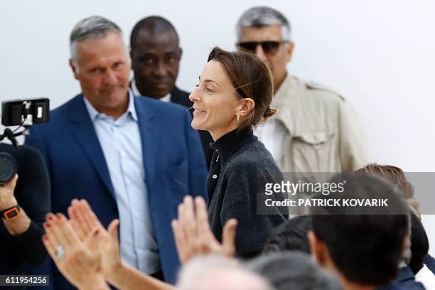 Fashion designer for Céline, Phoebe Philo , acknowledges the audience at the end of her 2017 Spring/Summer ready-to-wear collection fashion show, on...