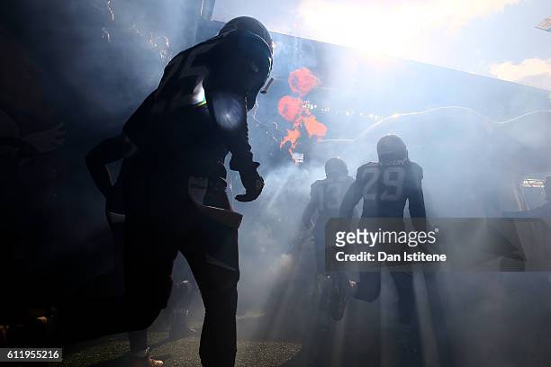 Josh Johnson of the Jacksonville Jaguars and Rashad Greene of the Jacksonville Jaguars run out for the start of the NFL game between Indianapolis...