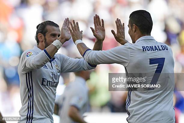 Real Madrid's Welsh forward Gareth Bale and Real Madrid's Portuguese forward Cristiano Ronaldo celebrate after scoring a goal during the Spanish...