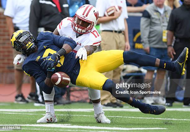 Saturday, October 1, 2016: Michigan's Channing Stripling tries to pick off a first quarter pas thrown by Wisconsin quarterback Alex Hornibrook....