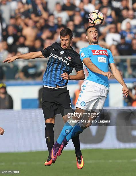 Nikola Maksimovic of Napoli competes for the ball in air with Aleksandar Pesic of Atalanta during the Serie A match between Atalanta BC and SSC...