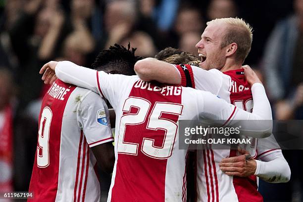 Ajax's players celebrate a goal during the Dutch Eredivise football match between Ajax Amsterdam and FC Utrecht at The Amsterdam ArenA in Amsterdam...