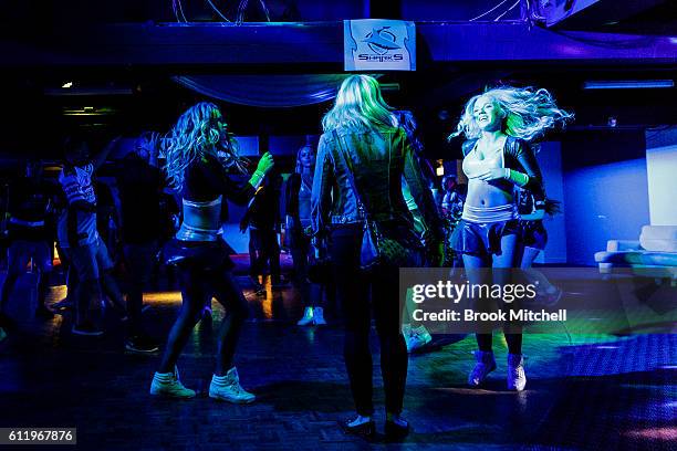 Sharks cheerleaders celebrate the Cronulla Sharks 2016 NRL Grand Final victory at the Sharks Leagues Club on October 2, 2016 in Sydney, Australia.