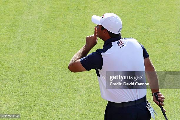 Patrick Reed of the United States gestures to the crowd on the first tee during singles matches of the 2016 Ryder Cup at Hazeltine National Golf Club...