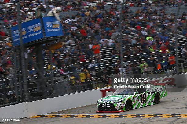 Daniel Suarez, driver of the Interstate Batteries Toyota, takes the checkered flag to win the NASCAR XFINITY Series Drive Sober 200 at Dover...