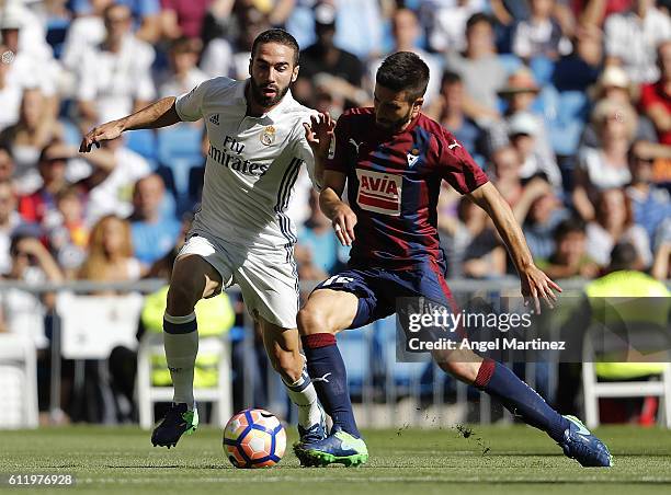 Daniel Carvajal of Real Madrid competes for the ball with Fran Rico of SD Eibar during the La Liga match between Real Madrid CF and SD Eibar at...