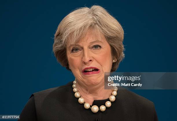 British Prime Minister Theresa May delivers a speech about Brexit on the first day of the Conservative Party Conference 2016 at the ICC Birmingham on...