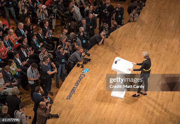 Photographers capture British Prime Minister Theresa May walk to deliver a speech about Brexit on the first day of the Conservative Party Conference...