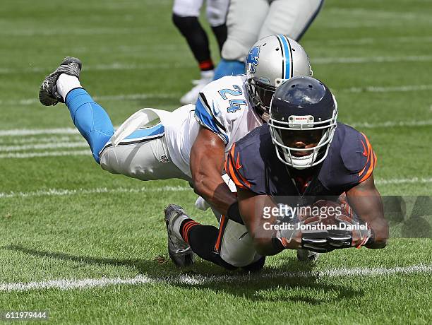 Eddie Royal of the Chicago Bears falls into the end zone to score a touchdwon dragging Nevin Lawson of the Detroit Lions with him at Soldier Field on...