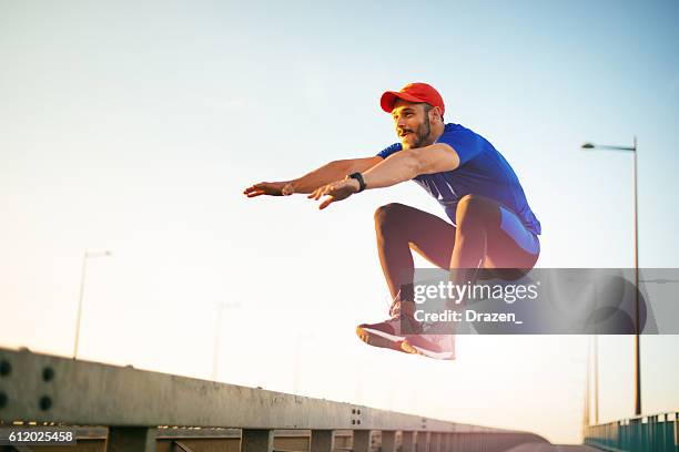 jumping and practicing parkour - circuit training stock pictures, royalty-free photos & images