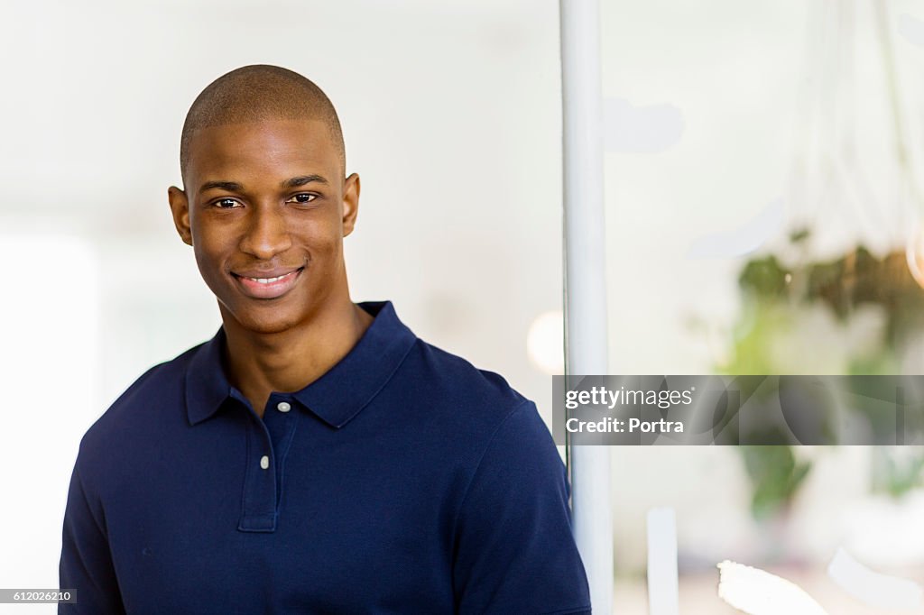 Young man smiling in cafe