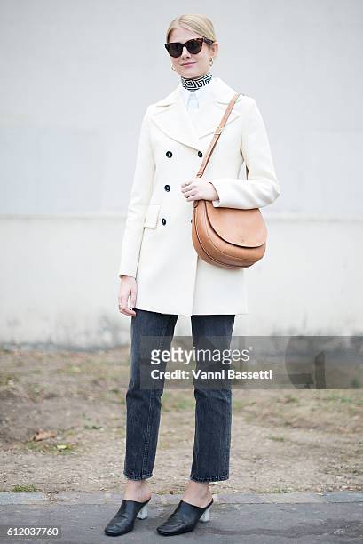 Guest poses wearing Celine after the Celine show at the Tennis Club de Paris during Paris Fashion Week Womenswear SS17 on October 2, 2016 in Paris,...