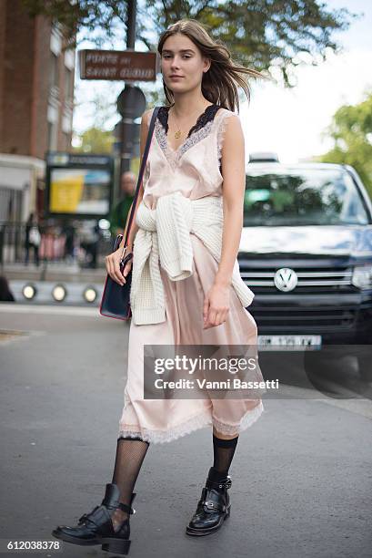 Model poses with a Celine bag after the Celine show at the Tennis Club de Paris during Paris Fashion Week Womenswear SS17 on October 2, 2016 in...