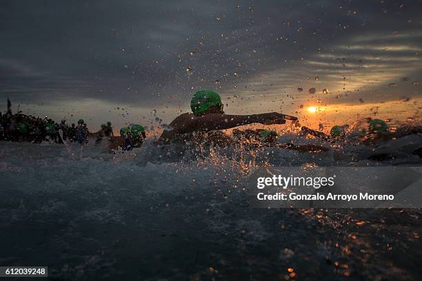 Pro athletes start the swimming course of the Ironman Barcelona on October 2, 2016 in Calella, Spain.