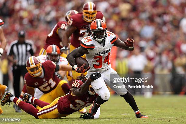 Running back Isaiah Crowell of the Cleveland Browns carries the ball against strong safety David Bruton of the Washington Redskins in the second...