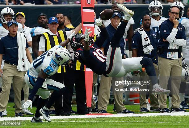 DeAndre Hopkins of the Houston Texans can't hold on to the pass as Perrish Cox of the Tennessee Titans defends at NRG Stadium on October 2, 2016 in...