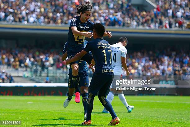 Matias Britos of Pumas celebrates with teammates after scoring during the 12th round match between Pumas UNAM and Chiapas as part of the Torneo...