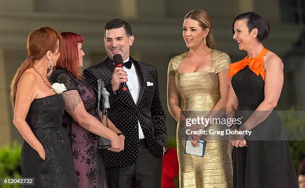 Actress, TV host, Singer, Beauty Queen and former Miss Universe, Alicia Machado presents an award at the Metropolitan Fashion Week 2016 Closing Gala...