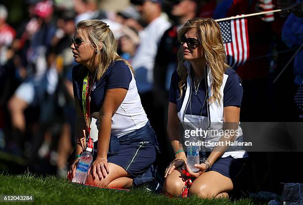Erica Holmes and Tabitha Furyk look on during singles matches of the 2016 Ryder Cup at Hazeltine National Golf Club on October 2, 2016 in Chaska,...