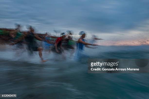 Pro female athletes start the swimming course of the Ironman Barcelona on October 2, 2016 in Calella, Spain.