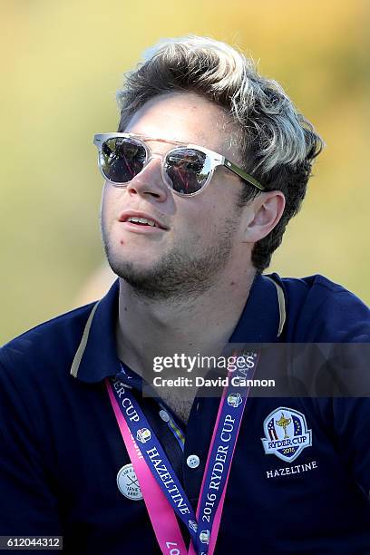 Singer Niall Horan of One Direction looks on during singles matches of the 2016 Ryder Cup at Hazeltine National Golf Club on October 2, 2016 in...