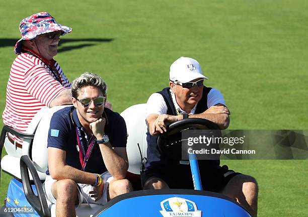 Singer Niall Horan of One Direction and actor Brian Doyle Murray look on during singles matches of the 2016 Ryder Cup at Hazeltine National Golf Club...