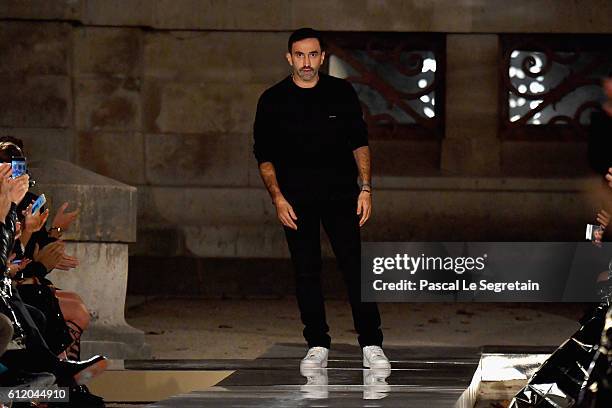 Designer Riccardo Tisci is seen on the runway during the Givenchy show as part of the Paris Fashion Week Womenswear Spring/Summer 2017 on October 2,...