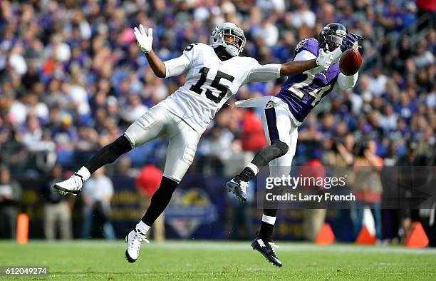 Shareece Wright of the Baltimore Ravens breaks up a pass intended for Michael Crabtree of the Oakland Raiders in the fourth quarter at M&T Bank...
