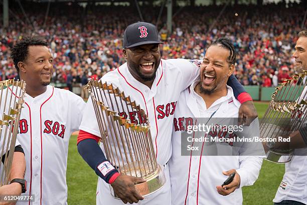 David Oritz of the Boston Red Sox laughs with former teammate Manny Ramirez during a ceremony honoring him before his final regular season game on...