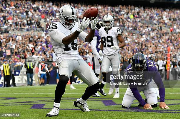 Michael Crabtree of the Oakland Raiders celebrates after scoring a touchdown in the fourth quarter against the Baltimore Ravens at M&T Bank Stadium...