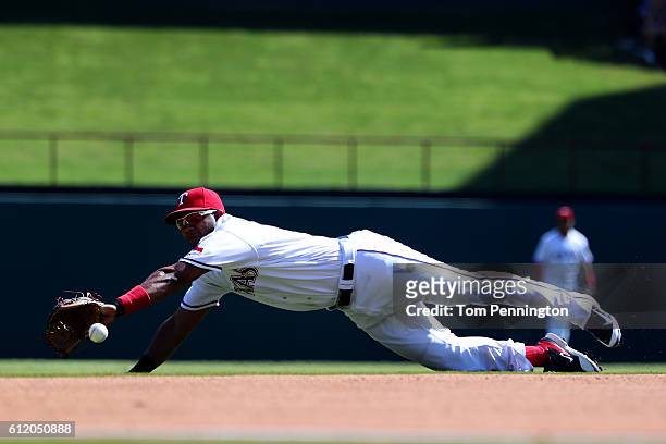 Elvis Andrus of the Texas Rangers misses fielding a ground ball single hit by Logan Forsythe of the Tampa Bay Rays in the top of the second inning at...
