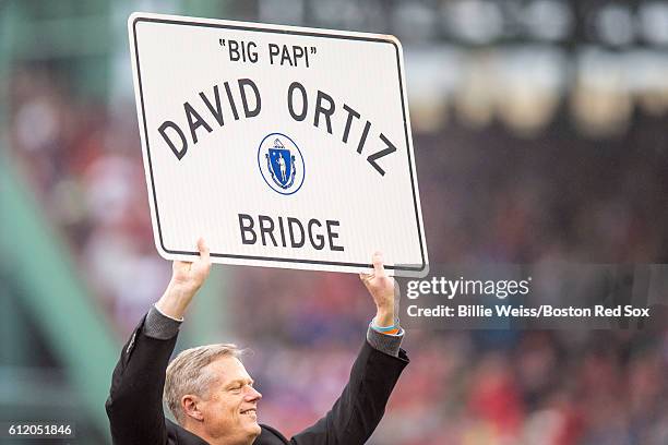 Massachusetts Governor Charlie Baker, presents David Ortiz of the Boston Red Sox with a street sign during an honorary retirement ceremony in his...
