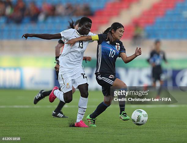 Fuka Nagano of Japan battles with Olivia Anokye of Ghana during the FIFA U-17 Women's World Cup Jordan 2016 Group D match between Ghana and Japan at...