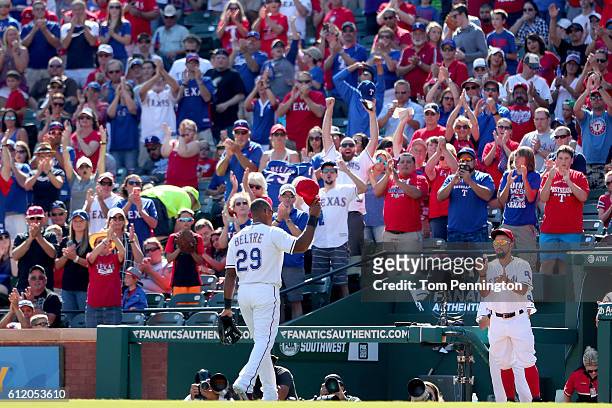 Adrian Beltre of the Texas Rangers waves to fans as he leaves the game against the Tampa Bay Rays in the top of the fourth inning at Globe Life Park...