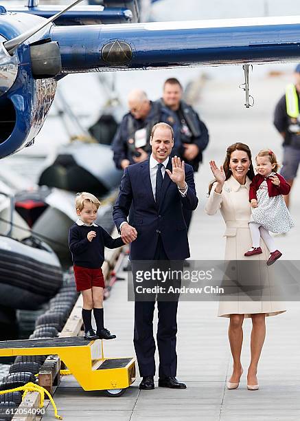 Prince George of Cambridge, Prince William, Duke of Cambridge, Catherine, Duchess of Cambridge and Princess Charlotte wave as they leave from...