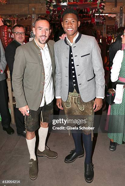 Bayern Soccer player Franck Ribery and David Alaba, wearing 'Amsel Fashion' attend the 'FC Bayern Wies'n' during the Oktoberfest at Kaeferschaenke /...