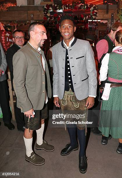 Bayern Soccer player Franck Ribery and David Alaba, wearing 'Amsel Fashion' attend the 'FC Bayern Wies'n' during the Oktoberfest at Kaeferschaenke /...