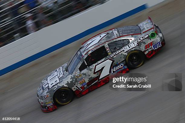 Regan Smith, driver of the Citizen Soldier Chevrolet, races during the NASCAR Sprint Cup Series Citizen Solider 400 at Dover International Speedway...