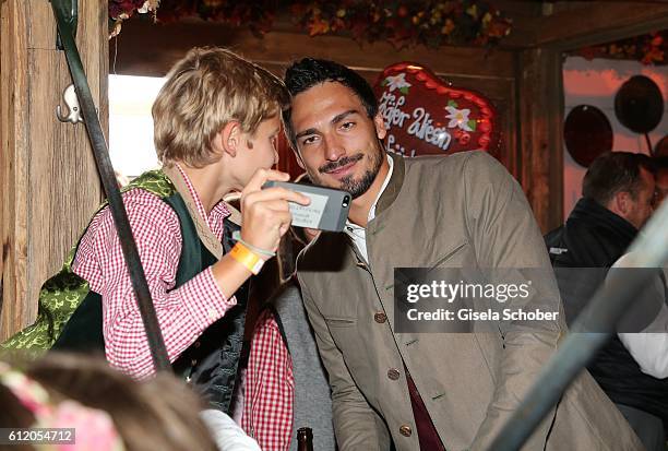 Bayern Soccer player Mats Hummels and fans attend the 'FC Bayern Wies'n' during the Oktoberfest at Kaeferschaenke / Theresienwiese on October 2, 2016...