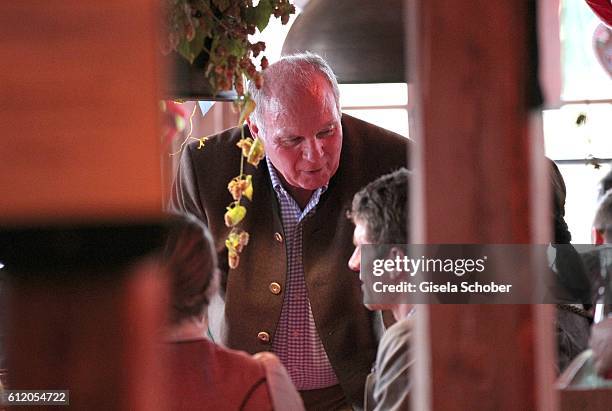 Uli Hoeness and Thomas Mueller, FC Bayern Soccer player, attend the 'FC Bayern Wies'n' during the Oktoberfest at Kaeferschaenke / Theresienwiese on...