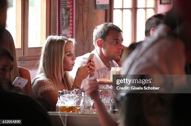 Manuel Neuer and his girlfriend Nina Weiss attend the 'FC Bayern Wies'n' during the Oktoberfest at Kaeferschaenke / Theresienwiese on October 2, 2016...