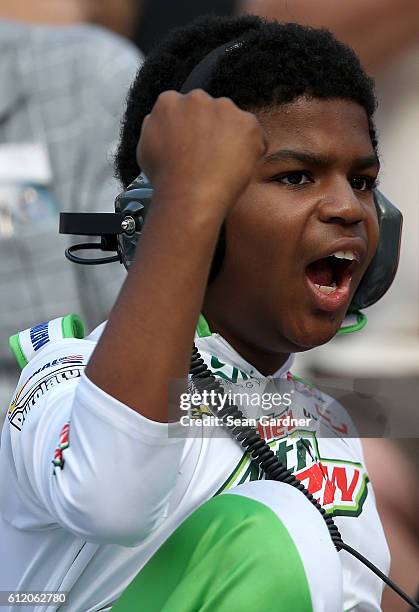 Young fan cheers during the NASCAR Sprint Cup Series Citizen Solider 400 at Dover International Speedway on October 2, 2016 in Dover, Delaware.
