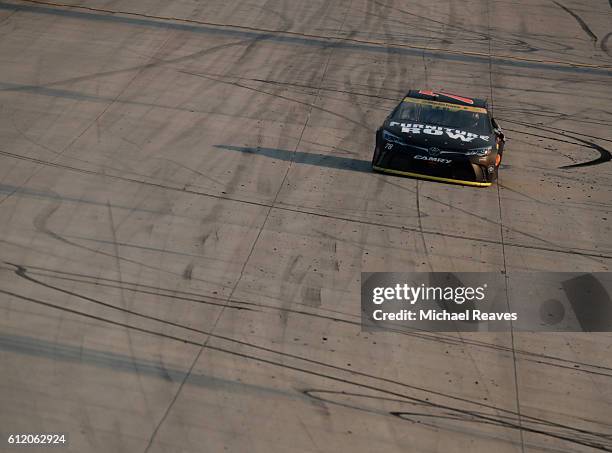 Martin Truex Jr., driver of the Furniture Row/Denver Mattress Toyota, celebrates after winning the NASCAR Sprint Cup Series Citizen Solider 400 at...