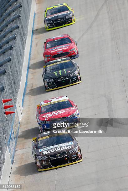 Tony Stewart, driver of the Nature's Bakery Brownie/Mobil 1 Chevrolet, leads a pack of cars during the NASCAR Sprint Cup Series Citizen Solider 400...