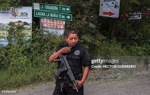 Police prevent the passage of people to La Yerbabuena community at La Becerrera community, Colima State, Mexico on October 2 due to teh actuivity of...