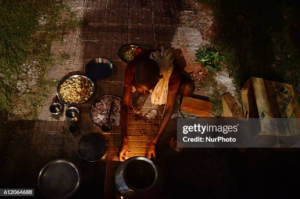 An indian man prepares food for artists,taking part in traditional Ramleela,a play narrating the life of Hindu God Ram,ahead of Dussehra festival,in...