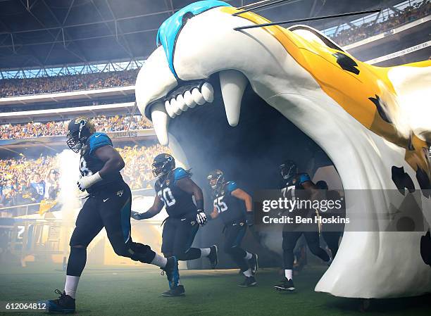 The Jacksonville team run out on to the pitch ahead of the NFL International Series match between Indianapolis Colts and Jacksonville Jaguars at...