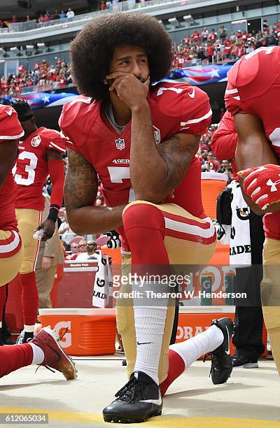 Colin Kaepernick of the San Francisco 49ers kneels on the sideline during the anthem prior to the game against the Dallas Cowboys at Levi's Stadium...